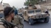 AFGHANISTAN -- A convoy of Afghan Special Forces is seen during the rescue mission of a police officer besieged at a check post surrounded by Taliban, in Kandahar province, Afghanistan, July 13, 2021. 