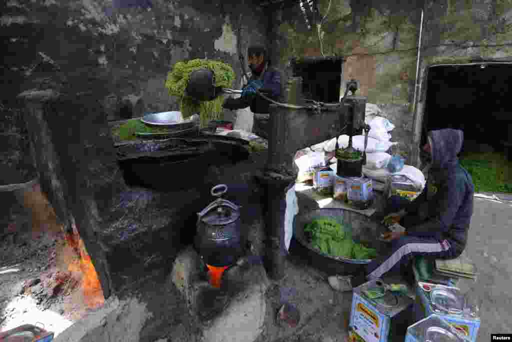 Afghan men make sweets at a small traditional factory in Kabul. (Reuters/Mohammad Ismail)