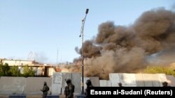 Smoke rises from the Governorate Council building of Basra, Iraq September 6, 2018