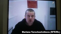 Leonid Razvozzhayev appears via video link at the Moscow City Court on January 21.
