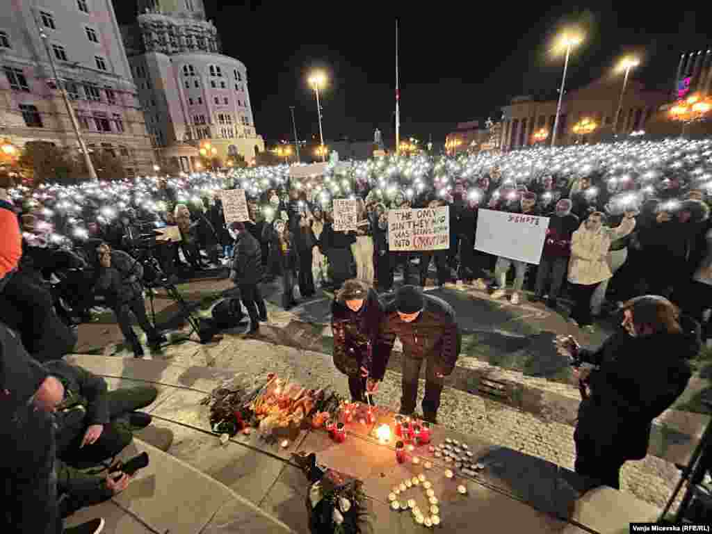 Crowds gather in Skopje on March 18 to mourn 63 people killed in a fire that had torn through the Kocani nightclub in North Macedonia's capital two days earlier.The nightclub was unlicensed and lacked a sprinkler system or adequate emergency exits. One of the banners in the crowd of the March 18 memorial stated, "Your greed turned children into ashes."Photo by Vanja Micevska/RFE/RL's North Macedonia Service.