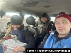 Tkachov with a Ukrainian film crew during the evacuation of a stork from near Pokrovsk in December 2024.