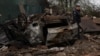 A Ukrainian police officer attends the site of a Russian military strike on a residential area in Pavlohrad on May 1. 