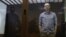 Russian opposition leader Aleksei Navalny attends a hearing to consider an appeal against an earlier court decision to change his suspended sentence to a real prison term in Moscow on February 20.