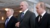 Belarus -- Russian President Vladimir Putin, his Kazakh and Belarusian counterparts Nursultan Nazarbaev and Alyaksandr Lukashenka pose prior a session of the Supreme Eurasian Economic Council in Minsk, April 29, 2014