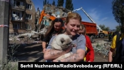 Survivors of the Russian attack left the rubble of their homes with few belongings, some carrying their pets.