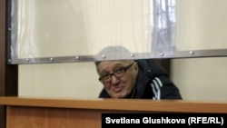 Bakhytzhan Kashkumbaev appears in court in Astana on January 22.