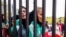 Iranian women waiting behind the gates of Tehran's Azadi stadium to be allowed to enter and watch a football game . Nov 10, 2018