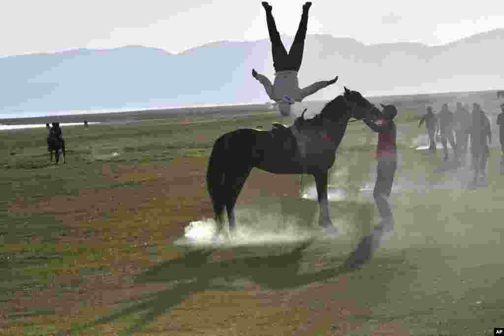 A participant performs an acrobatic exercise at Gallops 2025.