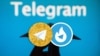 Iran-- logos of Hotgram and Talagram, with real Telegram in the backgroundund.