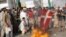 Pakistani protestors burn a Danish flag on 2 February.