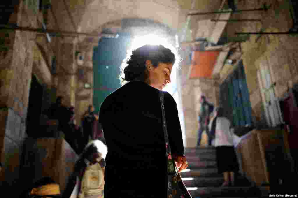 A Jewish worshipper prays in front of an entrance to the compound known to Muslims as Noble Sanctuary and to Jews as Temple Mount, on Tisha B&#39;Av, a day of fasting and lament, in Jerusalem&#39;s Old City. (Reuters/Amir Cohen)