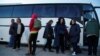 Evacuees wait to board a bus leaving the city of Mariupol in May. The state news agency TASS reported that over 2.8 million Ukrainians had entered Russia from Ukraine, including 448,000 children, as of July.