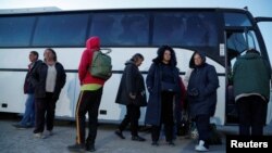 Evacuees wait to board a bus leaving the city of Mariupol in May. The state news agency TASS reported that over 2.8 million Ukrainians had entered Russia from Ukraine, including 448,000 children, as of July.