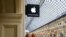 People pass an Apple store in central Moscow.
