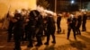 Specijalna policija ispaljuje suzavac ispred stadiona u Podgorici, 24. juni 2020.
