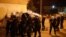 Riot police fire tear gas in front of a police station in Podgorica, Montenegro on June 24.
