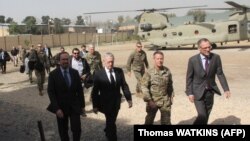 FILE: U.S. Defense Secretary Jim Mattis (2nd left) arrives at NATO's Resolute Support mission in Kabul in September.