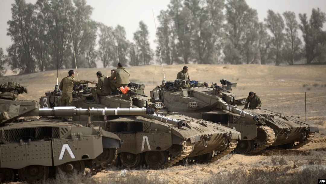 Israeli tanks stationed at the Israeli-Gaza Strip border on November 16