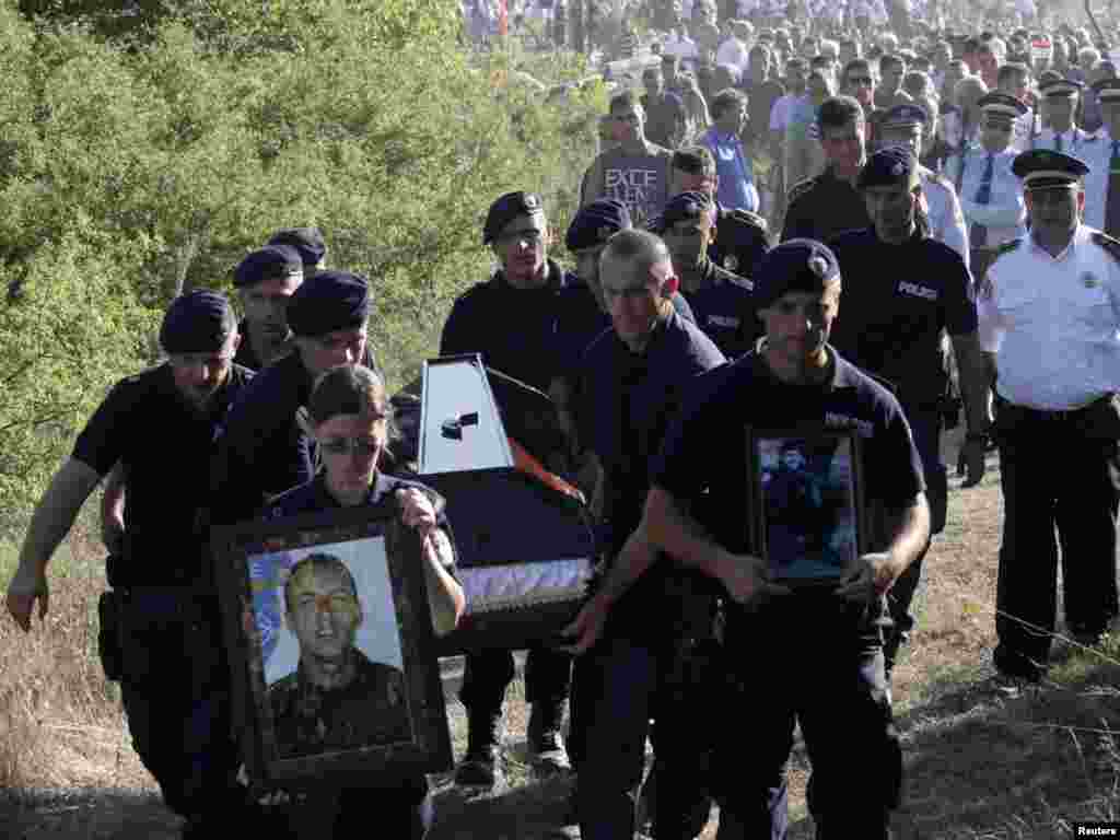 Members of the Kosovo special police unit carry the coffin of Enver Zymber at his funeral on July 27.