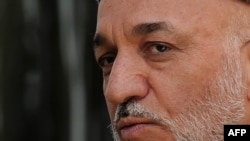 Lawmakers accuse President Hamid Karzai of trying to intimidate parliament.