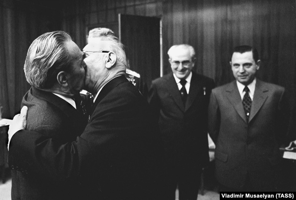 Brezhnev locking lips with Nikolai Podgorny in the Kremlin in 1975