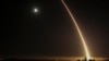 A streak of light trails off into the night sky as the U.S. military test-fires an unarmed intercontinental ballistic missile at Vandenberg Air Force Base, northwest of Los Angeles, California, in 2017.