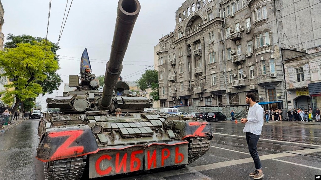 Wagner mercenaries sit atop a tank outside the headquarters of the Southern Military District in Rostov-on-Don, Russia, on June 24. Earlier, Wagner chief Yevgeny Prigozhin said his forces were making a "march of justice" to Moscow.