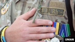 Ukraine -- Ukrainian serviceman during a rally on Independence Square in Kyiv, May 18, 2016