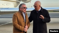 US President Donald Trump's special envoy, Steve Witkoff (left), is greeted by Russian presidential envoy Kirill Dmitriev upon his arrival in Saint Petersburg on October 21.