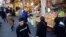 Iranians shop at Tehran's Molavi bazaar. The Iranian economy has been hit bard by U.S. sanctions.