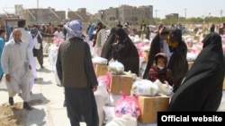 World Food Programme staff distribute food aid in Herat in August.