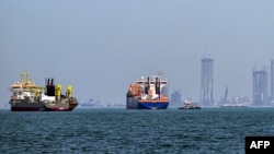 Commercial vessels are pictured offshore in Dubai on March 11.