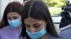 Krestina and Angelina Khachaturyan (right) arrive at the Moscow City Court for a hearing earlier this year. 