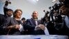 Azerbaijan -- Presidential candidate Jamil Hasanli casts his ballot at a polling station in Baku, October 9, 2013.