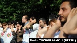 Акция в поддержку задержанных фоторепортеров