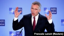 NATO Secretary-General Jens Stoltenberg speaks to reporters in Brussels on October 3.