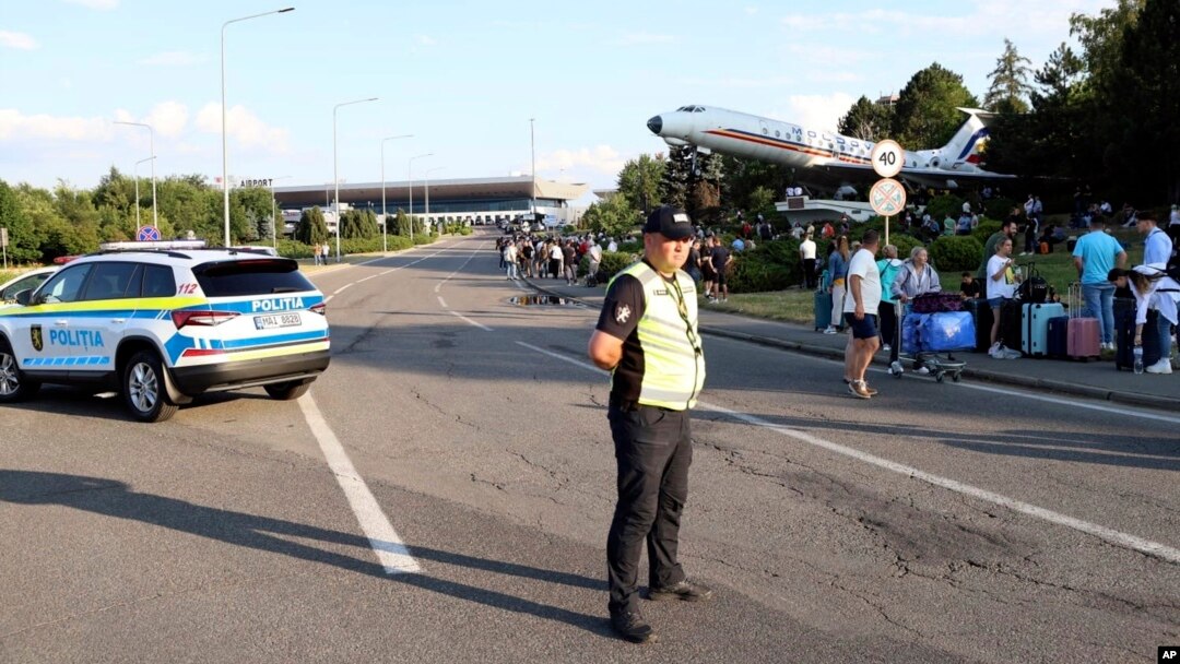 Passengers are evacuated from Chisinau airport in Moldova on June 30 after a shooting incident left two people dead. 