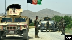 Afghan National Army soldiers patrol the Shah Wali Kot district of Kandahar Province.