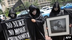 Тэатралізаваныя акцыі супраць Чарнобылю праводзілі летась актывісты Грынпіс у розных краінах