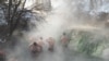 Migrants bathe at thermal springs, Sarajevo, Bosnia and Herzegovina