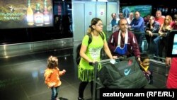  Armenia - The Syrian Armenian family of Kohar Galustian, her husband Jean and two children arrive at Yerevan airport, 11Oct2016. 