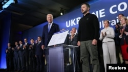 U.S. President Joe Biden (left) and Ukrainian President Volodymyr Zelenskiy attend a Ukraine Compact meeting on the sidelines of the NATO summit in Washington in July.