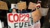 Swedish environmental activist Greta Thunberg (left) protests in Tbilisi on November 11 against COP 29 being held in Baku, Azerbaijan.