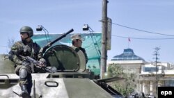 An armored vehicle patrols in front of the parliament building in Ulan Bator