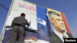 An election billboard of Kosovo Prime Minister Hashim Thaci, who has been accused of playing the lead role in an organ trafficking operation.