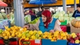 Moldova, Maria Coman (80) sells fruit and vegetables at the Central Market in Chișinău. She is the oldest vendor at the Central Market.