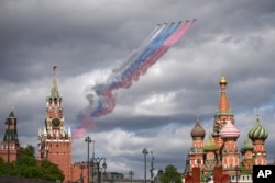 Russian jets fly over Red Square leaving trails of smoke during rehearsals for the May 9 Victory Day parade.