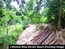 Logs that were being used to build out a tunnel into Lithuanian territory.