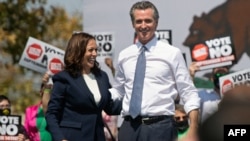 U.S. Vice President Kamala Harris (left) stands with California Governor Gavin Newsom during a campaign event in San Leandro, California, in September 2021.